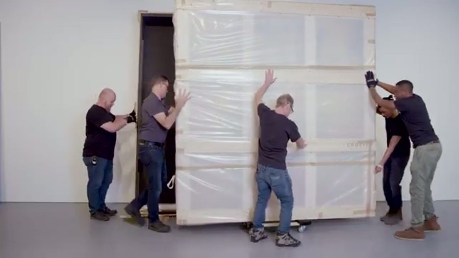 Crew wrapping furniture with care